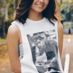 woman wearing white sleeveless top standing on asphalt road during daytime