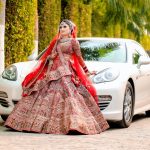 Indian Bride in a Lehenga Standing in front of a Car