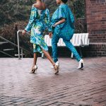 two women in teal romper pants