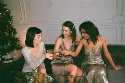 Three Women Sitting on a Sofa