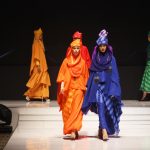 woman wearing dresses walking on catwalk