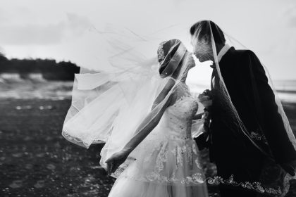 grayscale shot of bride and groom