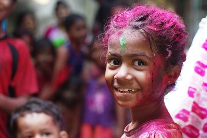 selective focus photo of girl in shirt smiling