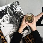 woman holding clear glass candle holder and grayscale portrait of a woman